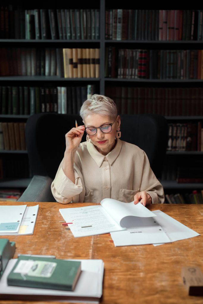 Reader checking close-up text at a comfortable distance