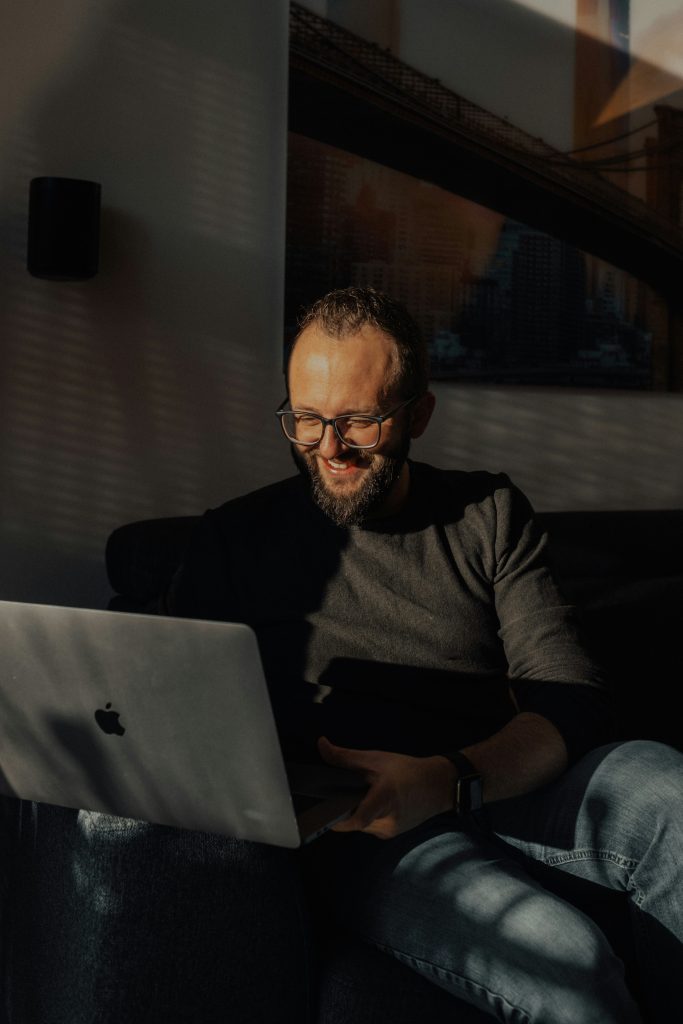 Person wearing glasses while using a laptop