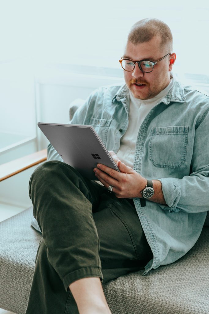 Person using a tablet while wearing glasses