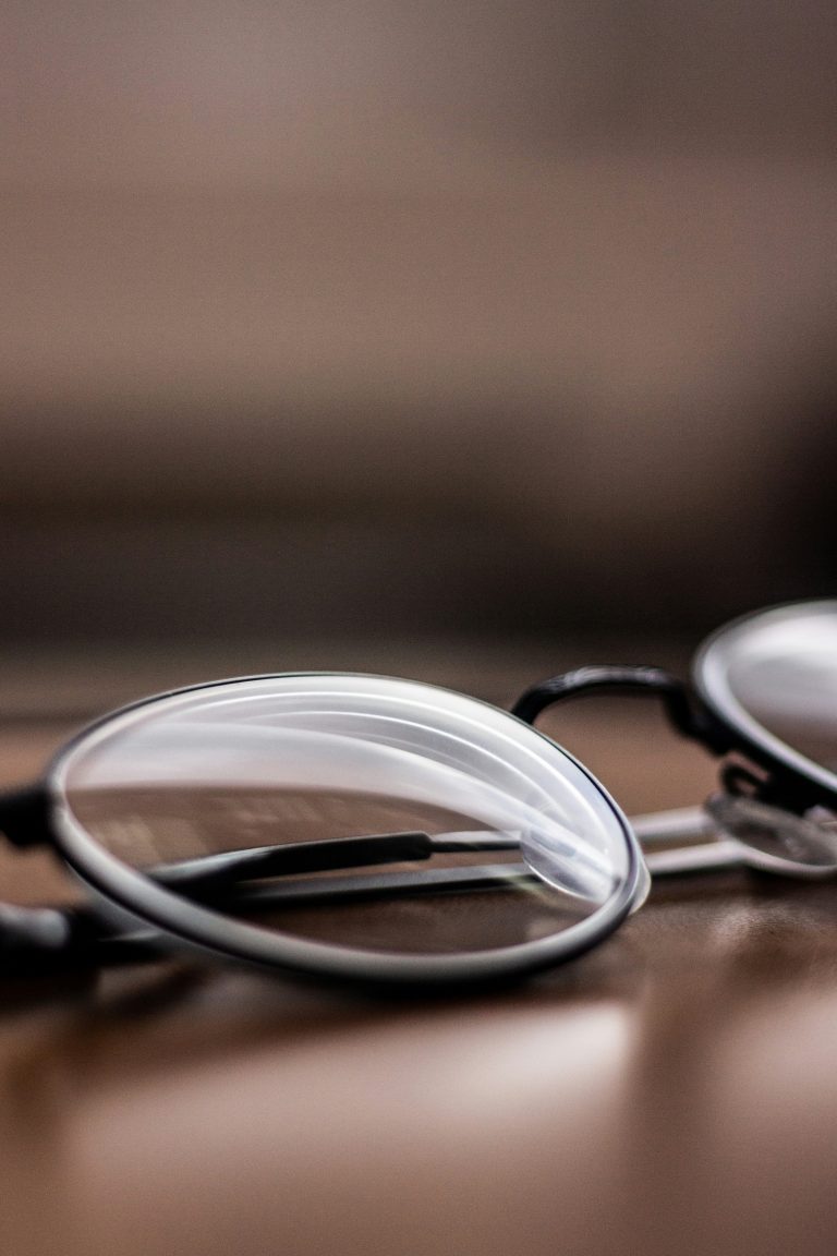 Close-up of reading glasses ready for cleaning and care
